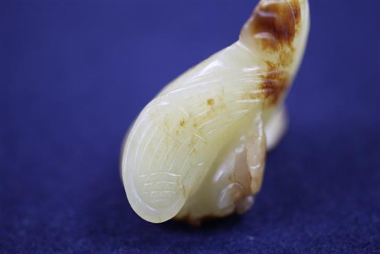 A small Chinese yellow and russet jade figure of a phoenix, 18th century, 4.5cm